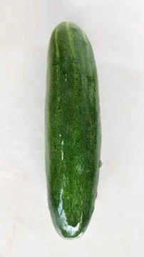Cucumber on a white background, top view, close-up Stock Photos