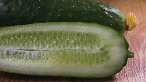 Cucumber on a wooden surface close-up 스톡 동영상 131440658