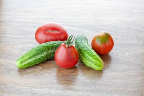 Cucumbers and tomatoes Stock Photos