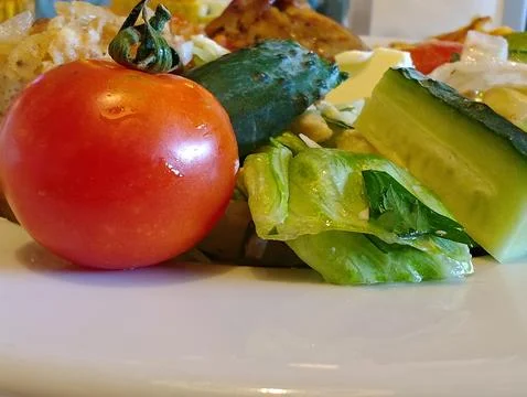 Cucumbers and tomatoes Stock Photos