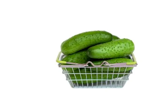 Cucumbers in a basket on a white background Stock Photos