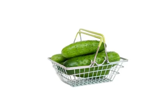 Cucumbers in a basket on a white background Stock Photos
