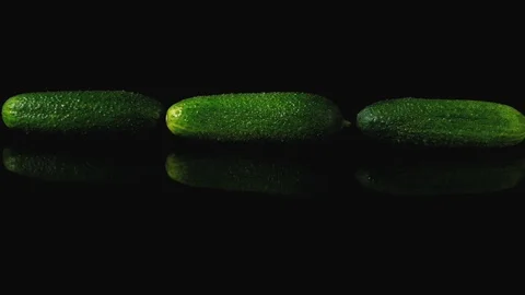 Cucumbers on the black mirror table. Stock Footage 113204614
