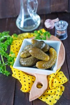 Cucumbers in bowl on a table Stock Photos