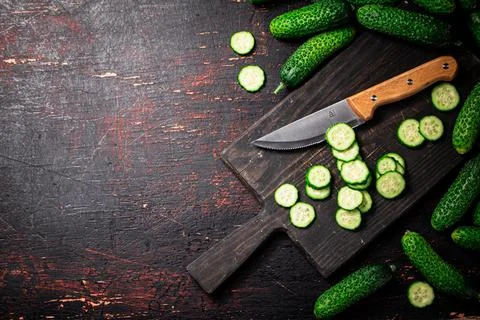 Cucumbers cut on a cutting board. Stock Photos