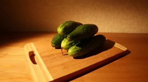 Cucumbers on a cutting board Stock Footage 49997316