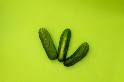 Cucumbers on a green background, monochrome Stock Photos