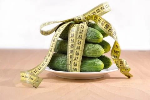 Cucumbers with  measuring tape Stock Photos
