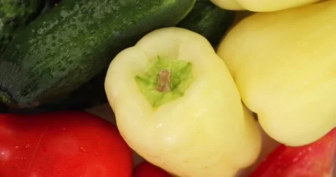 Cucumbers, peppers and tomatoes rotate. Fresh vegetables Close up. Super slow Stock Footage 157654673