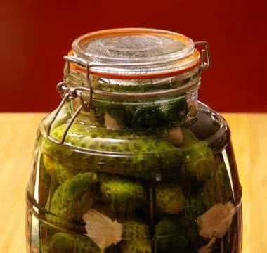 Cucumbers pickled in glass Stock Photos