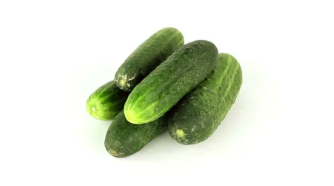 Cucumbers rotate on a white background loop Stock Footage 40418176