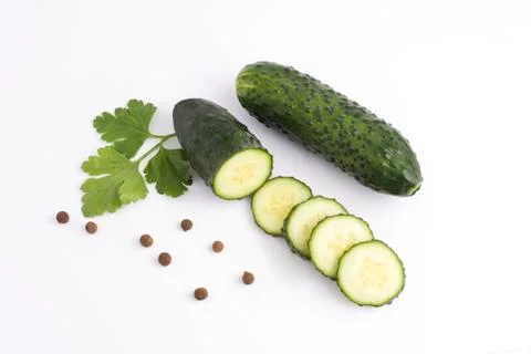 Cucumbers on a white background.Fresh vegetables on a white background. Ogrun Stock Photos