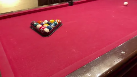 Cue Ball Break Shot on Red Pool Table in Luxury Bar Stock Footage 320663362