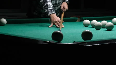 Cue in man's hand hits the white ball and it doesn't hit the pocket Stock Footage 262559682
