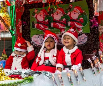 Cuenca, Ecuador - Dec 23, 2012: Children dressed as Santas Stock Photos