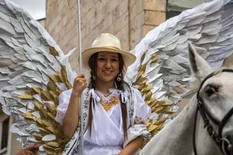 Cuenca, Ecuador - December 24, 2015 - Woman on horseback dressed as an angel Stock Photos