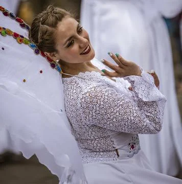 Cuenca, Ecuador - December 24, 2015 - Young woman dressed as an angel during  Stock Photos
