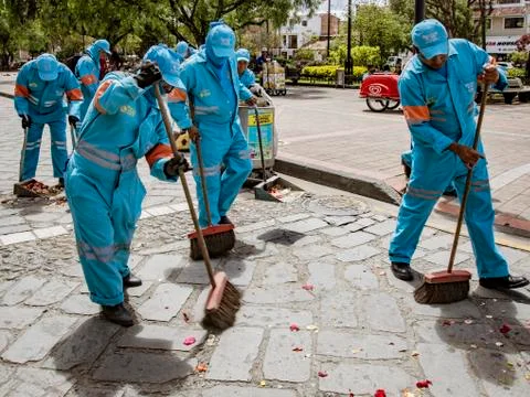 Cuenca, Ecuador, Jan 13, 2018: Crew cleans up after parade Stock Photos