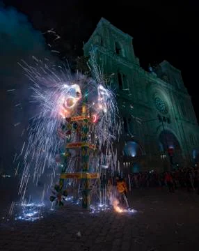Cuenca, Ecuador - June 1, 2018: A fireworks castle is fired in front of a chu Foto stock