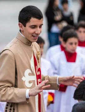 Cuenca, Ecuador - June 4, 2015 - Catholic Curate (priest trainee) talks to yo Foto stock