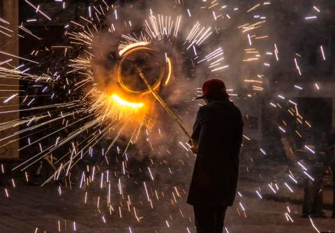 Cuenca, Ecuador - Nov 29, 2012: Man holds fireworks pinwheel Stock Photos
