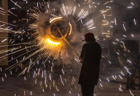 Cuenca, Ecuador - Nov 29, 2012: Man holds fireworks pinwheel Stock Photos