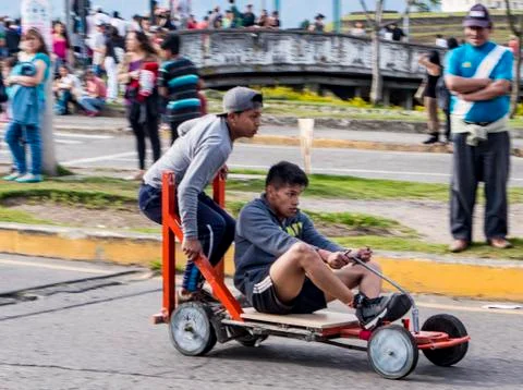 Cuenca, Ecuador - November 3, 2015 - Teenage boys race their home-built soap box Stock Photos