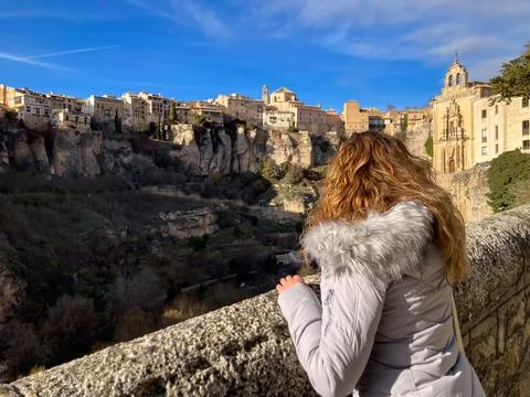 Cuenca, Spain; December 6 2021: Woman viewing historic Cuenca from San Pabl.. 写真素材