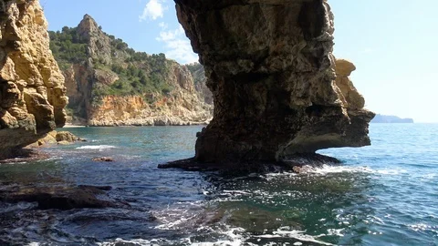 Cueva dels Arcs in the cliff of Cala Moraig in Spain. Stock Footage 109597588