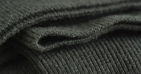 Cuff and hem of modern grey jumper 4K sliding video Video stock 259542500
