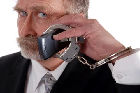 Cuffed to phone Stock Photos