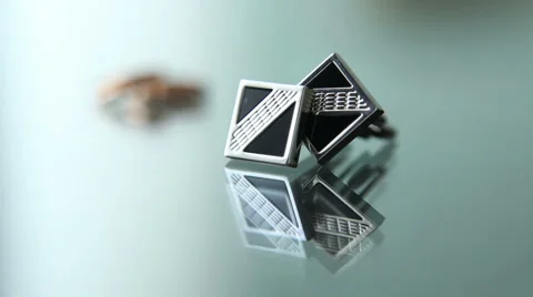 Cufflinks and wedding rings Stock Footage 54455479
