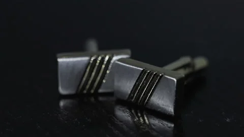 Cufflinks lie on the table Vídeo Stock 93436710
