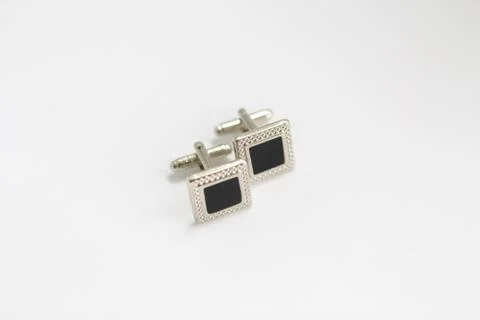 Cufflinks on a white background Stock Photos