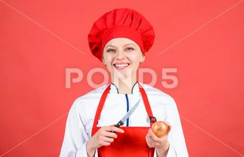 Cuisine. woman in cook hat and apron. happy woman cooking healthy food by recipe Stock Photos