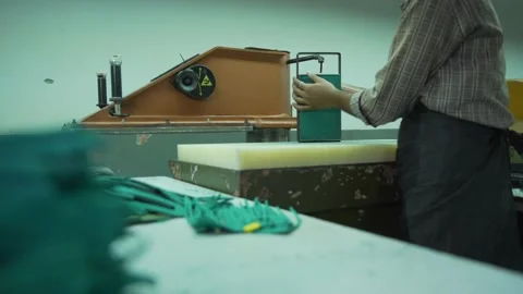 Cuitting green colour raw leather manufacturing in factory Stock Footage 202459789
