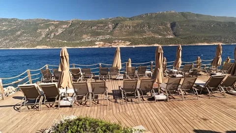 Cukurbag, Kas, Turkey - August 29, 2026 Beach deck and umbrellas Stock Footage 344879678