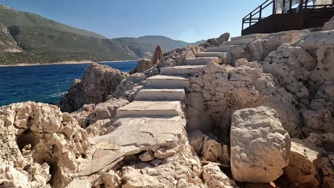 Cukurbag, Kas, Turkey - August 29, 2026 Walking up stone stairs Stock Footage 344879736
