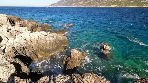 Cukurbag, Kas, Turkey - August 29, 2026 Waves on rocky coast Stock Footage 344880107