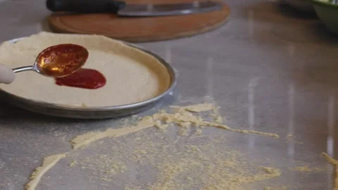 Culinary Artistry Unleashed: Chef's Hands Craft Delicious Pizza with Precision Stock Footage 258649527