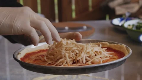 Culinary Artistry Unleashed: Chef's Hands Craft Delicious Pizza with Precision Stock Footage 259062914