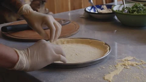 Culinary Artistry Unleashed: Chef's Hands Craft Delicious Pizza with Precision Stock Footage 259063830
