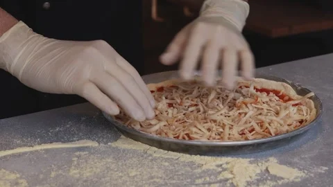 Culinary Artistry Unleashed: Chef's Hands Craft Delicious Pizza with Precision Stock Footage 259405560
