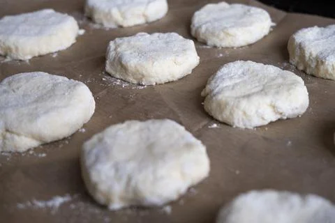 Culinary background. Cookie dough on baking paper. Stock Photos