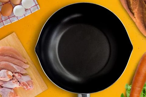 Culinary Concept with Black Pan, Fresh Meat and Ingredients Фото