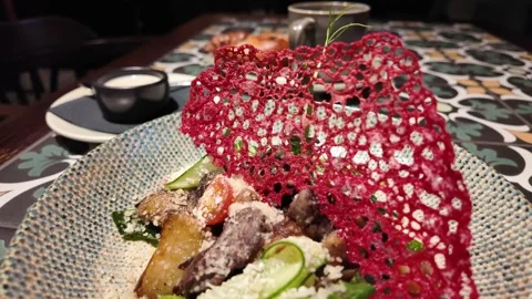 A culinary experience showcasing traditional dishes with artistic presentation a Vidéo 299996287