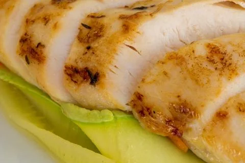 A culinary focus showcasing a macro shot of the grilled chicken fillet's text Stock Photos