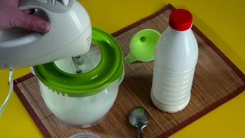 Culinary preparation. Beating the dough with a mixer Stock Footage 149146018