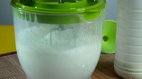 Culinary preparation. Beating the dough with a mixer Stock Footage 149146100