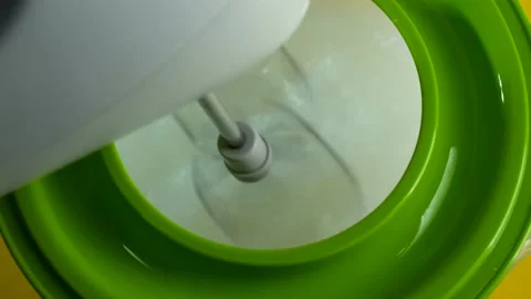 Culinary preparation. Beating the dough with a mixer Stock Footage 149146283